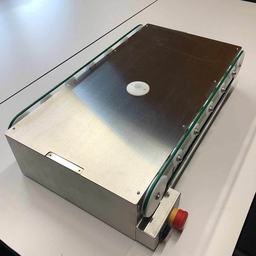 Unité de transport pour déposant automatique